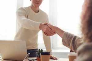 Making a deal for a job and shaking hands